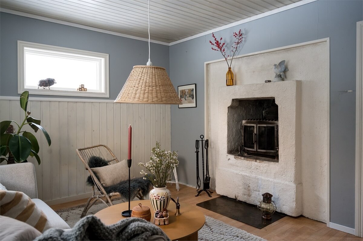A Charming Countryside Villa in Sweden 10 small-livng-room-fireplace-light-blue-walls-nordroom