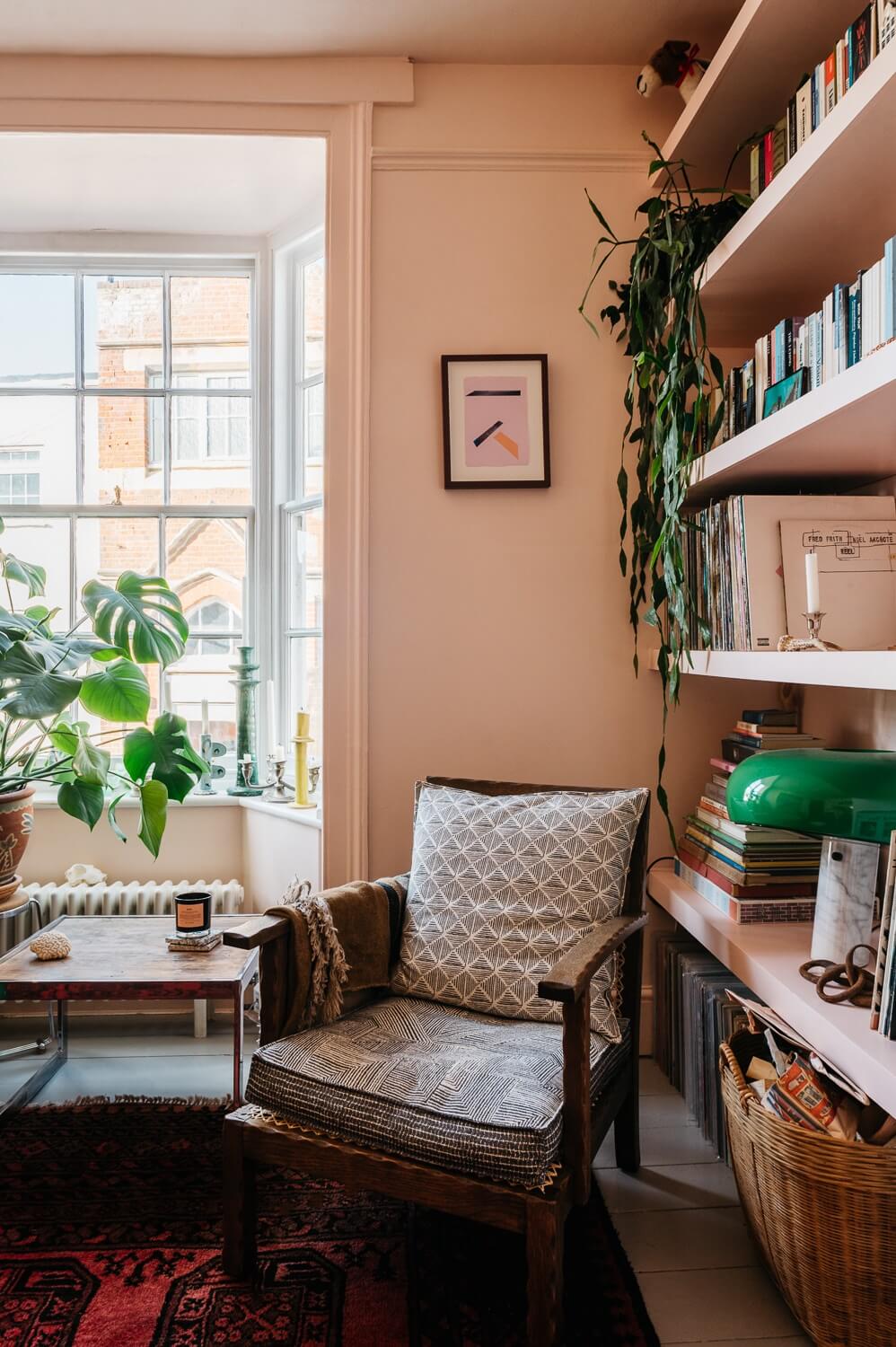Colorful Rooms in a Historic English Home 3 small-pink-living-room-bookshelfs-nordroom