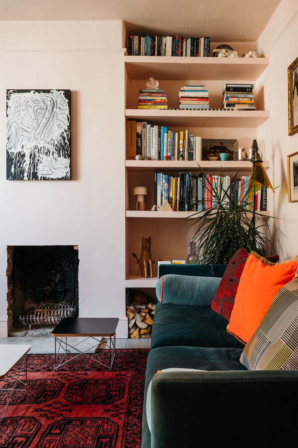Colorful Rooms in a Historic English Home 2 small-pink-living-room-built-in-bookshelves-fireplace-nordroom