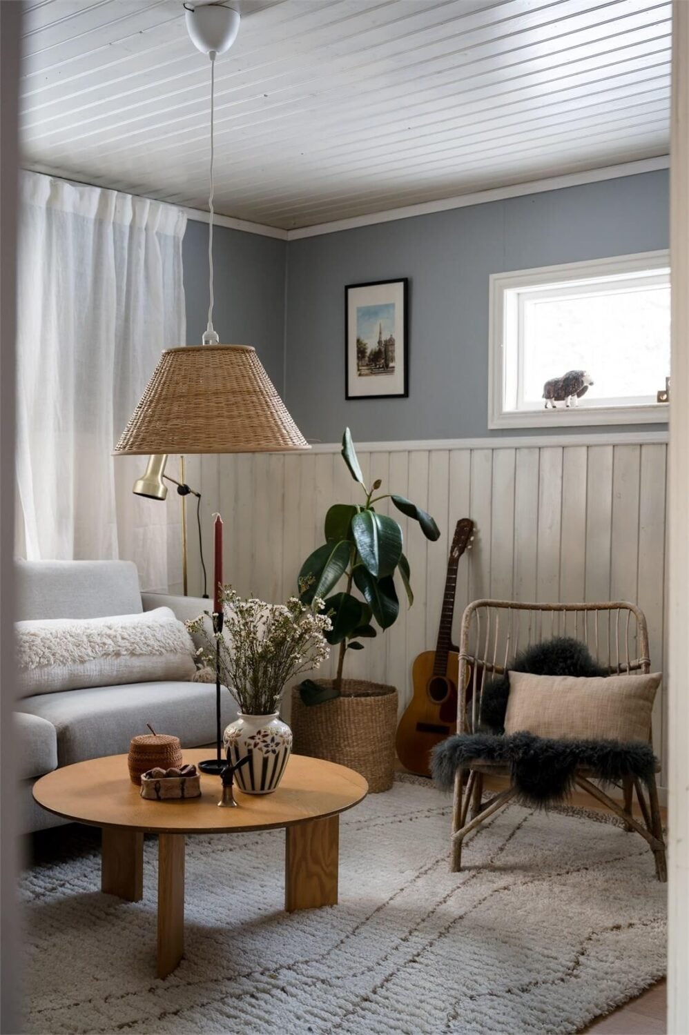 A Charming Countryside Villa in Sweden 8 small-swedish-sitting-room-light-blue-walls-nordroom
