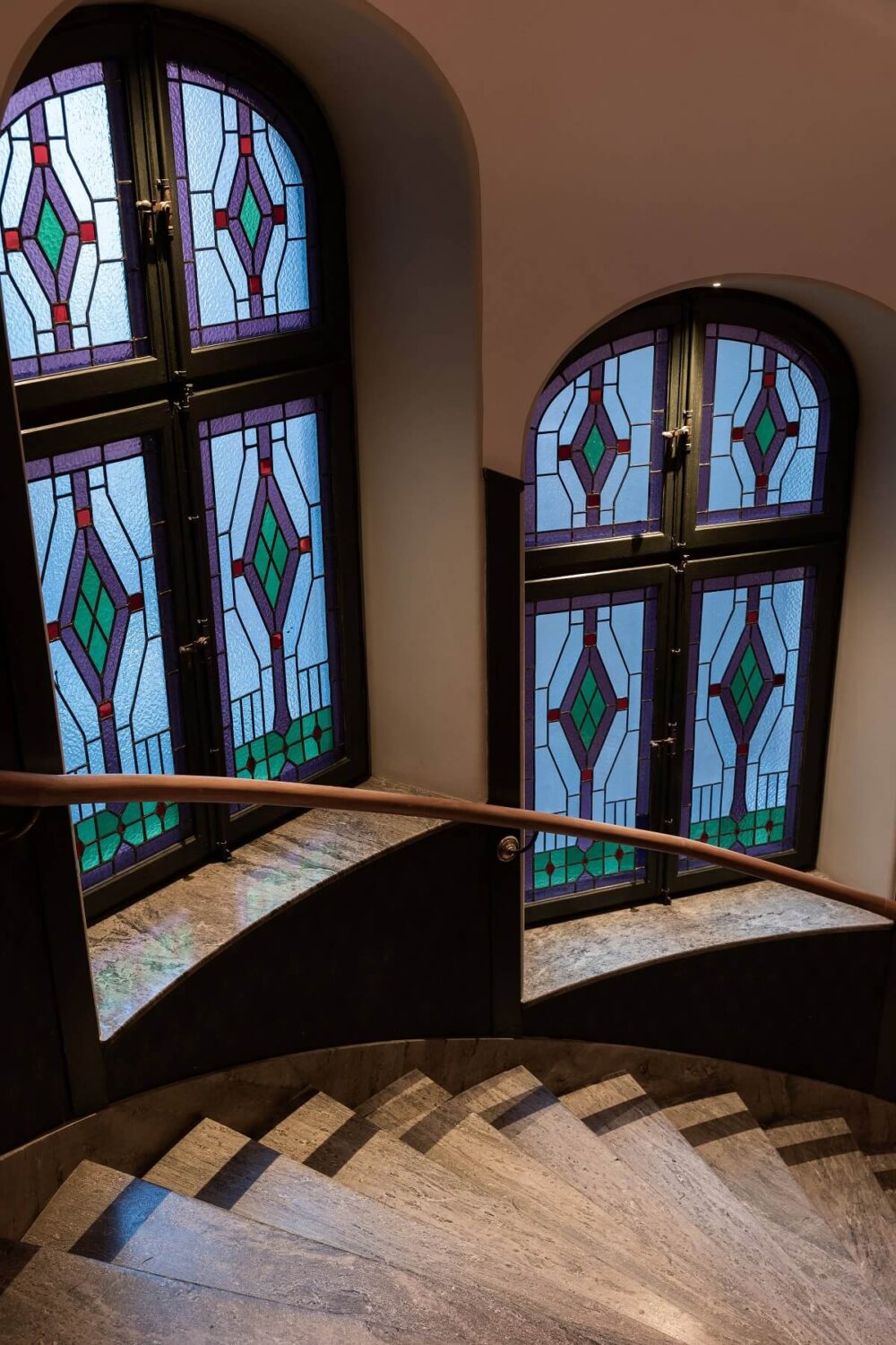 A Stylish Gray Apartment in Stockholm 20 spiral-staircase-stained-glass-windows-apartment-complex-stockholm-nordroom
