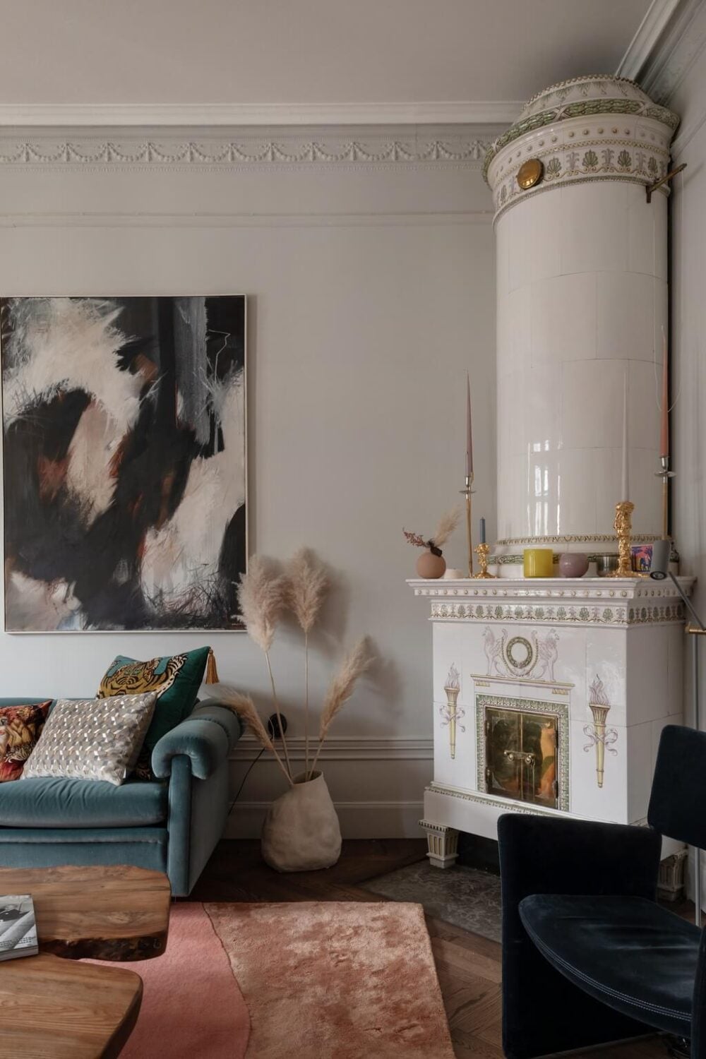 A Classic Swedish Apartment with Light Gray Walls 7 tile-fireplace-living-room-blue-sofa-light-gray-walls-nordroom