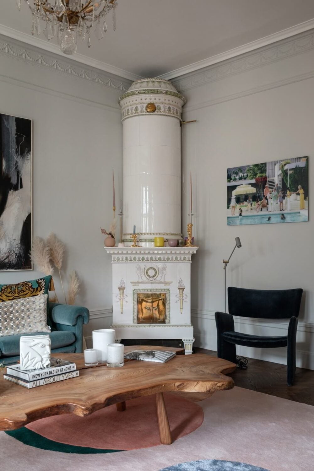 A Classic Swedish Apartment with Light Gray Walls 6 tile-fireplace-pastel-colored-rug-living-room-nordroom