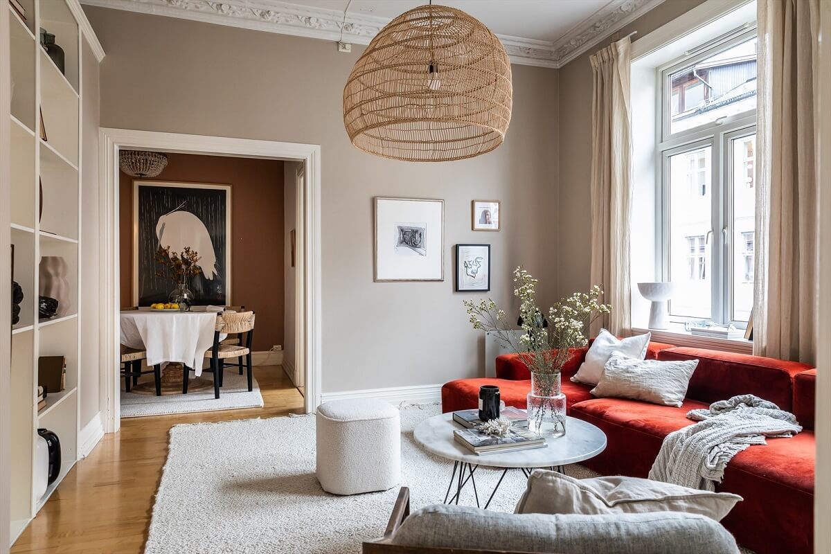 An Oslo Apartment Painted in Warm Color Tones 6 warm-natural-living-room-red-sofa-nordroom