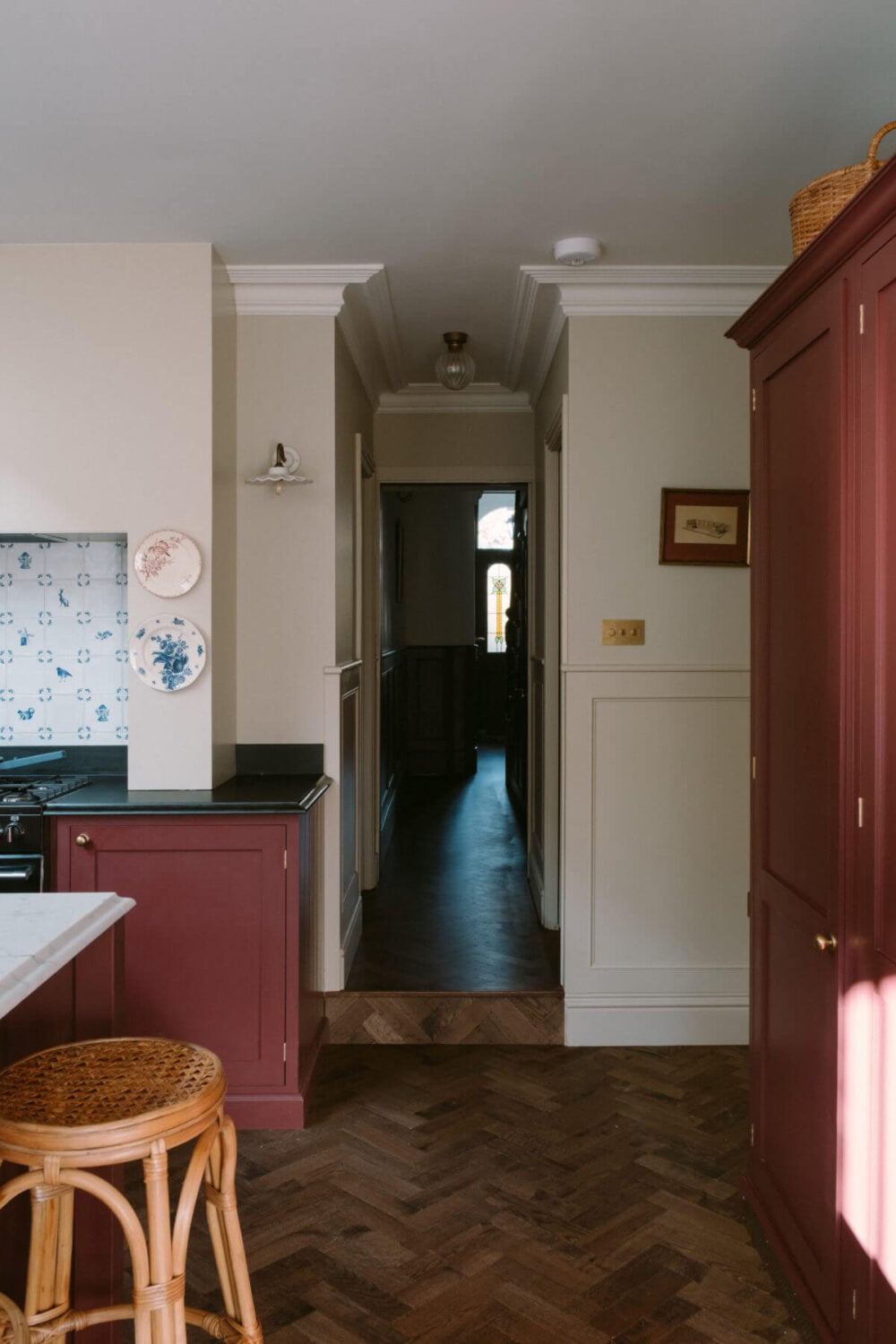 A Deep Red Kitchen in a Victorian Home in London 19 warm-wooden-herringbone-floor-hallway-kitchen-nordroom