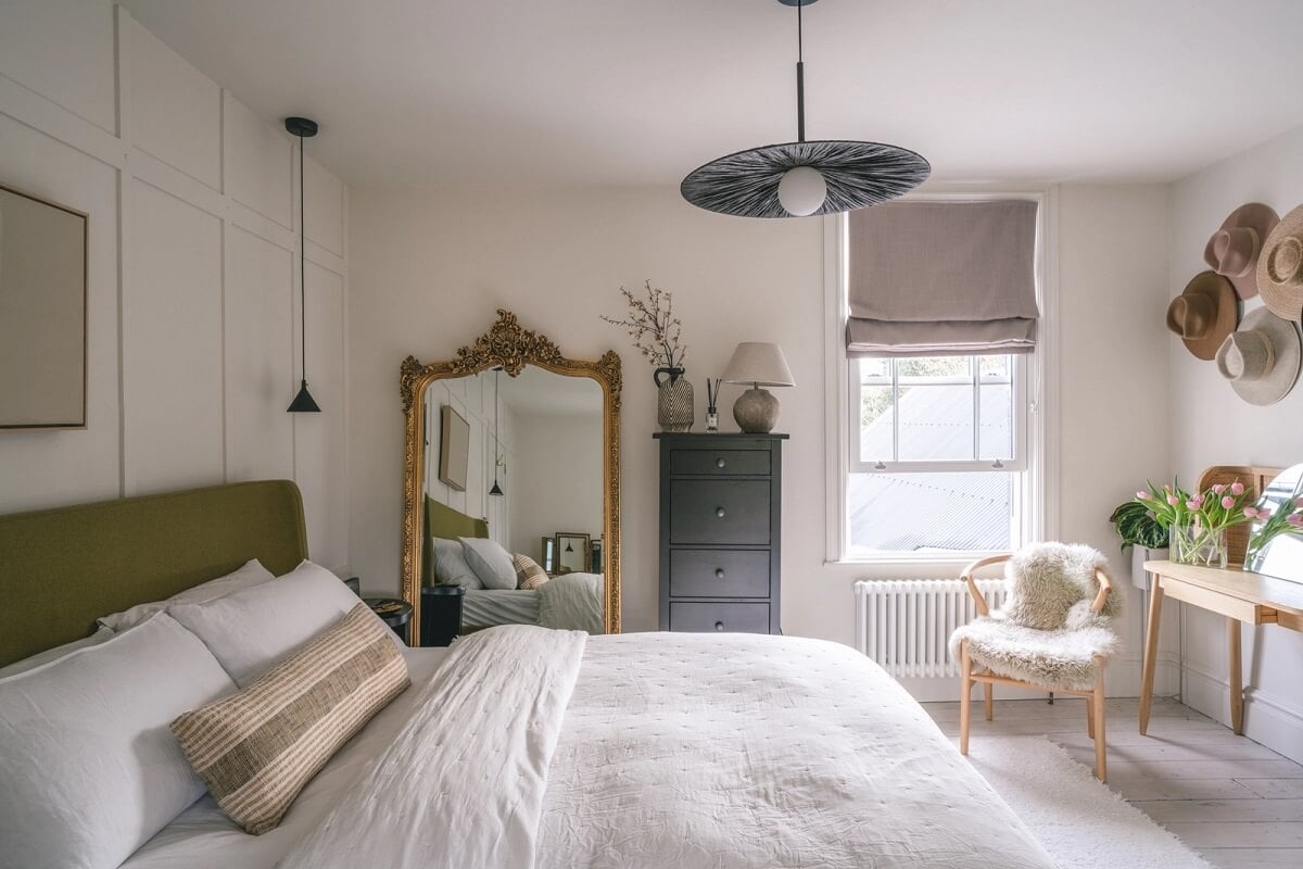 A Victorian Home with a Modern Black Extension 17 white-bedroom-antique-mirror-green-headboard-nordroom