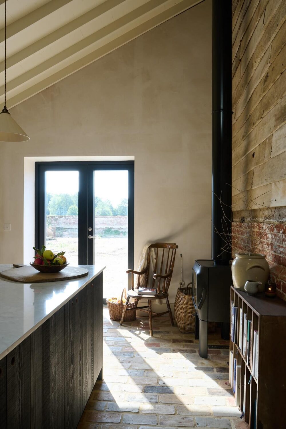 A deVOL Sebastian Cox Kitchen in a 17th Century Barn House 10 woodburner-sitting-area-The-Sebastian-Cox-Kitchen-deVOL-barn-house-nordroom