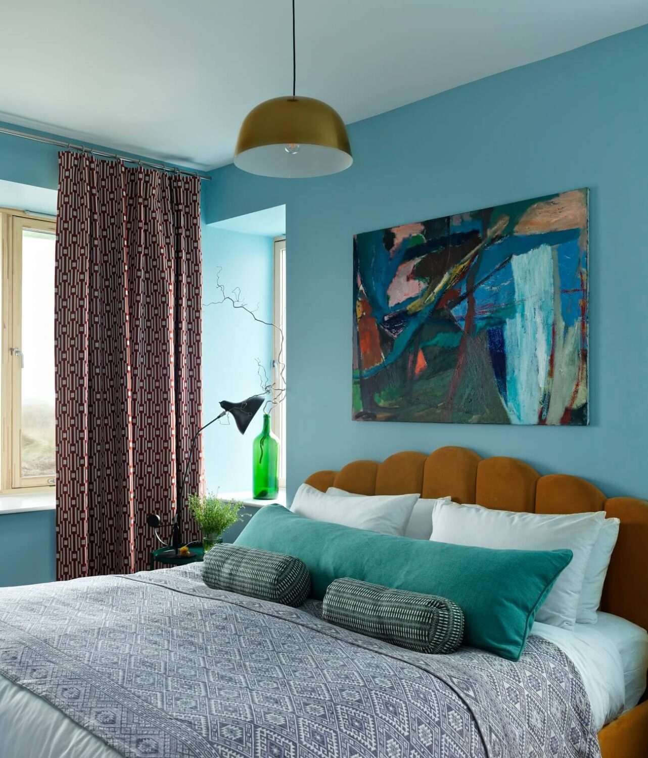 A Colorful House By The Sea Designed by Space A 9 70s-style-Bedroom-blue-walls-ochre-yellow-headboard-nordroom