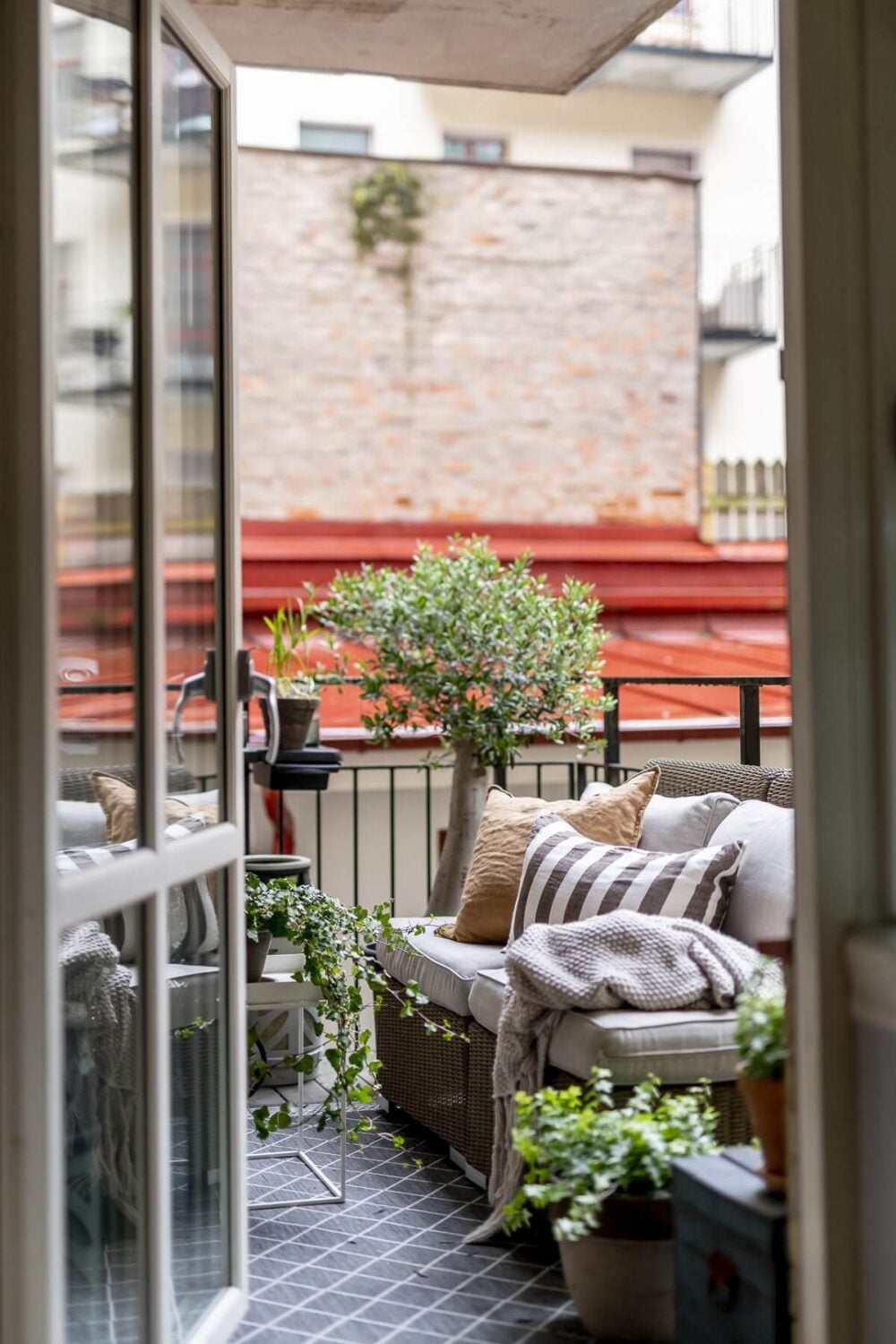 Layered Textiles and Dusty Colors in a Nordic Apartment 18 balcony-plants-scandinavian-apartment-nordroom