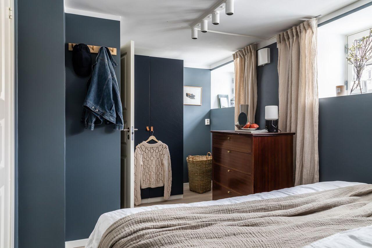Soft Neutral Colors in a Norwegian Maisonette Home 12 basement-bedroom-high-windows-blue-walls-nordroom