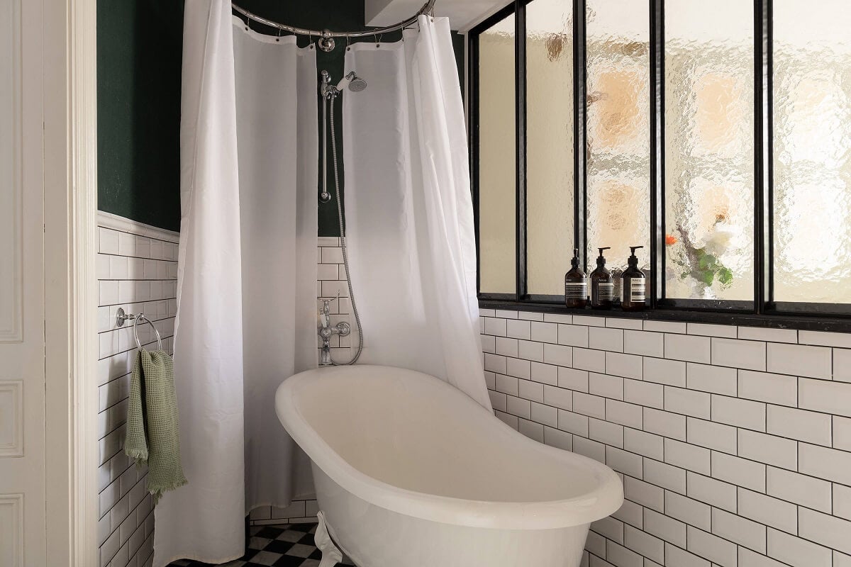 A Classic Maisonette Home in Stockholm 12 bathroom-freestanding-bath-white-wubway-tiles-industrial-window-nordroom