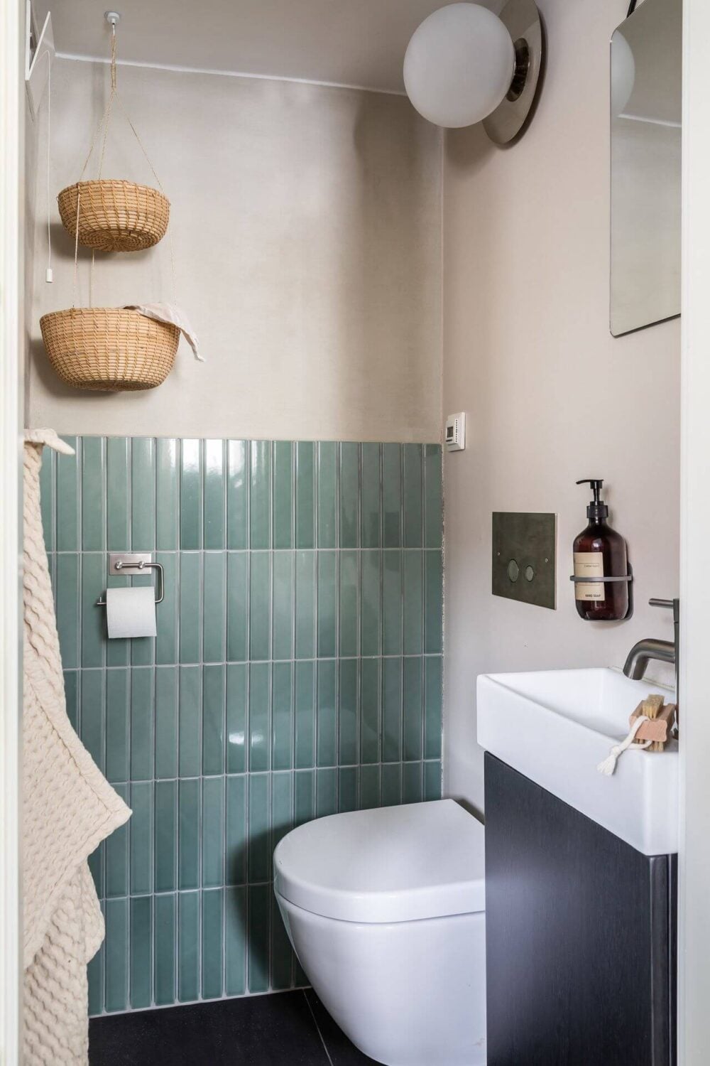 Soft Neutral Colors in a Norwegian Maisonette Home 16 bathroom-sea-green-tiles-nordroom