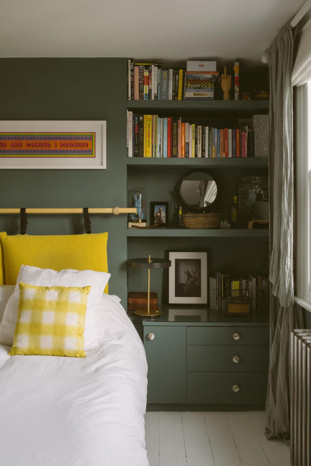 A Victorian House in London Decorated in Warm Color Tones 26 bedroom-green-walls-built-in-shelves-yellow-cushions-nordroom