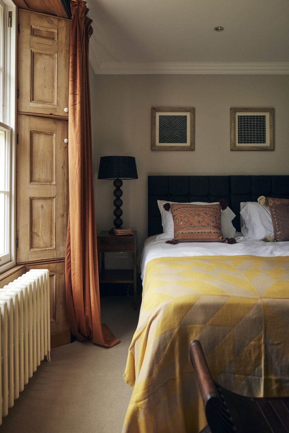 A Peaceful Georgian House in the English Countryside 18 bedroom-light-gray-walls-wooden-shutters-yellow-bedspread-nordroom