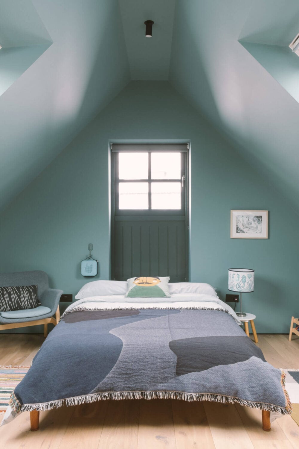 A Modern Split-Level Home with Colorful Rooms 26 bedroom-slanted-ceiling-blue-walls-nordroom