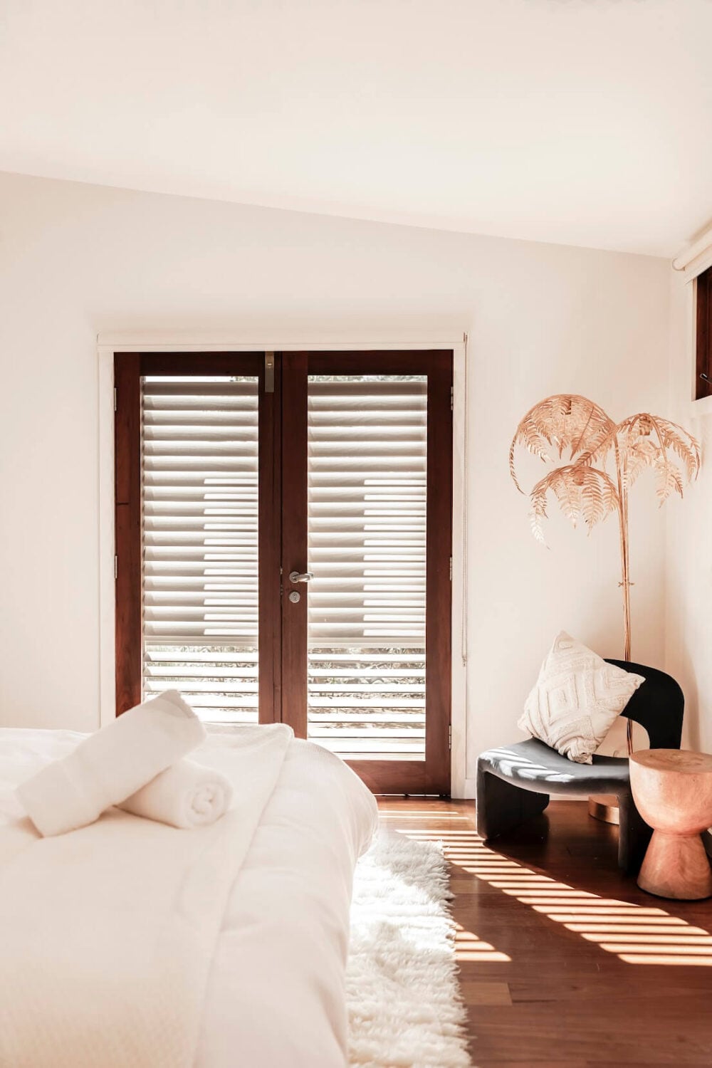 Oyster Catcher Huskisson: A Sustainable Beach House in Australia 19 bedroom-white-walls-velvet-chair-nordroom