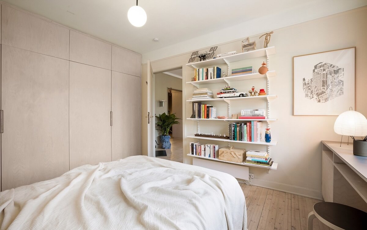 A Modern Oslo Apartment with Custom Furniture and Storage 15 beige-bedroom-built-in-wardrobes-bookshelves-nordroom
