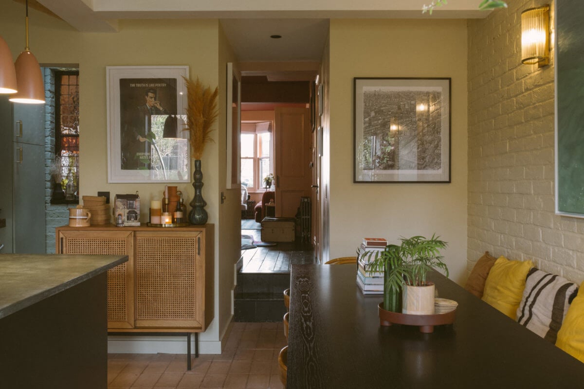A Victorian House in London Decorated in Warm Color Tones 12 black-dining-table-bench-painted-brick-wall-nordroom