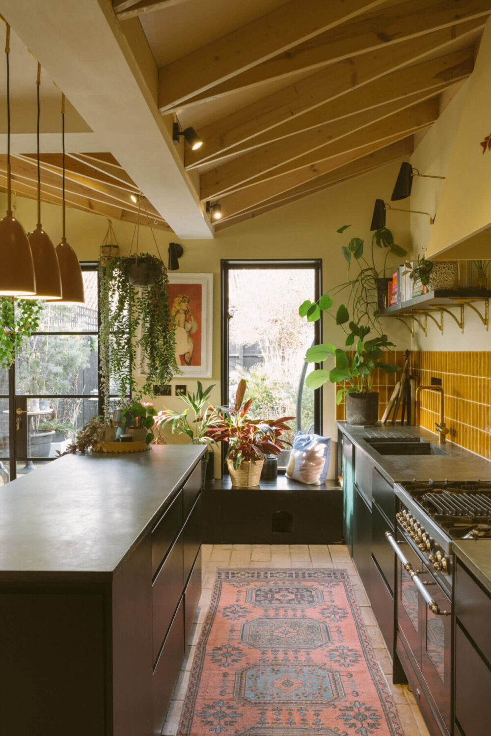 Glidden & PPG Color of the Year 2024: Limitless 13 black-kitchen-ochre-yellow-tiles-wooden-beams-slanted-ceiling-nordroom