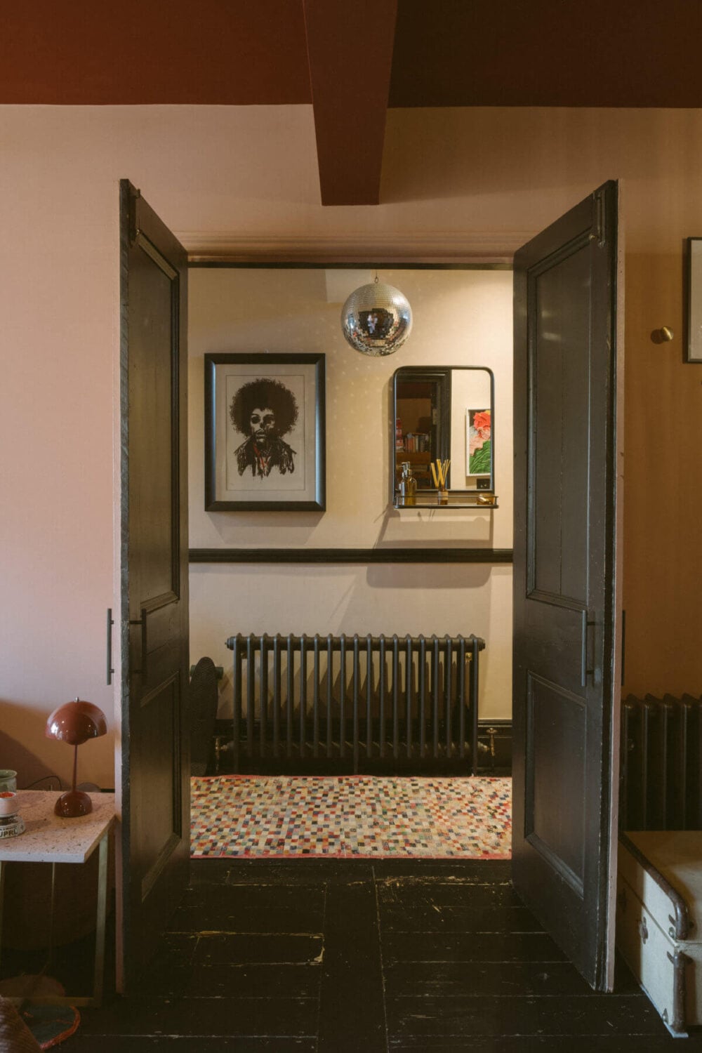 A Victorian House in London Decorated in Warm Color Tones 22 black-painted-double-doors-hallway-nordroom