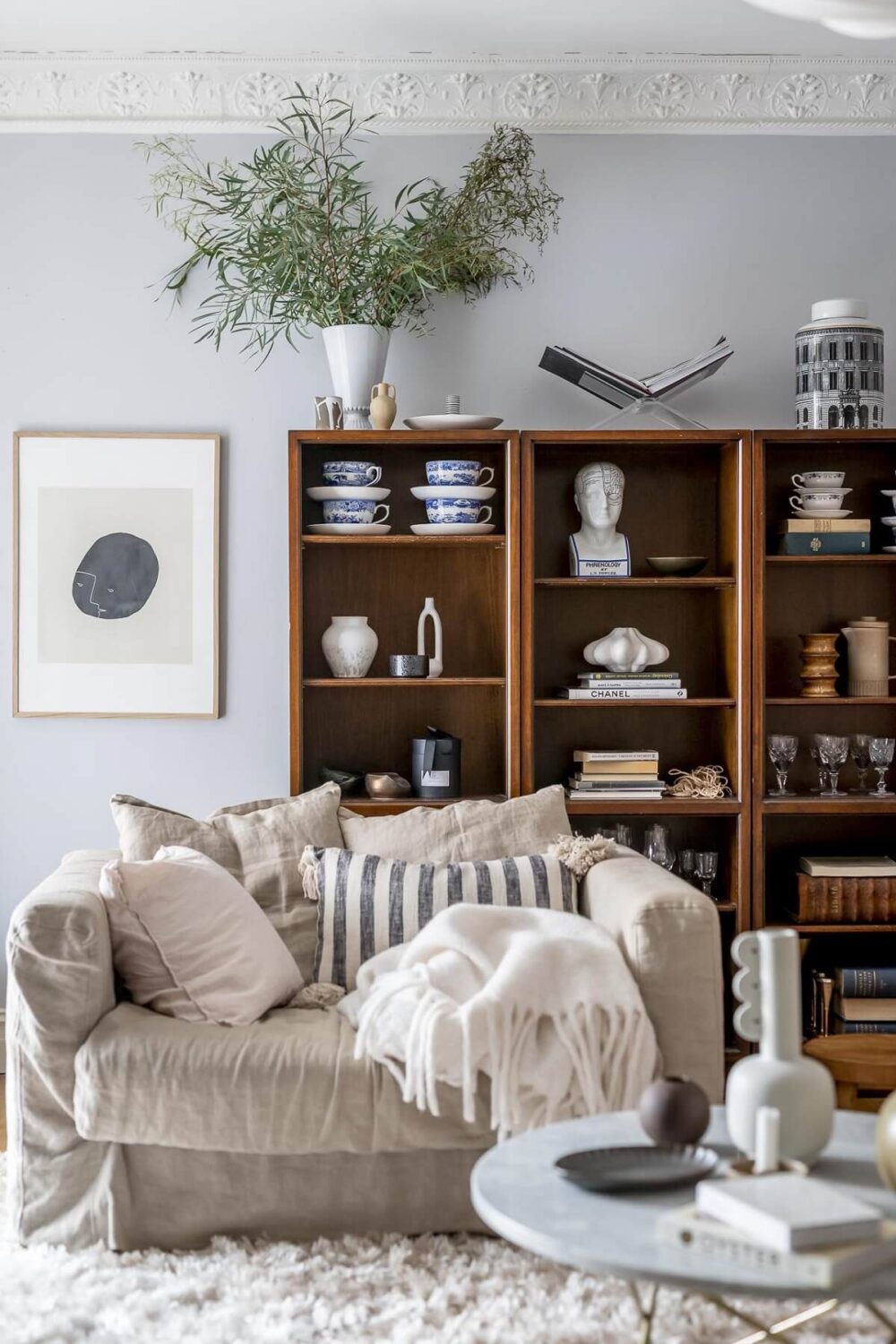 Sherwin-Williams Color of the Year 2024: Upward 17 bookcase-light-blue-walls-sitting-room-nordroom