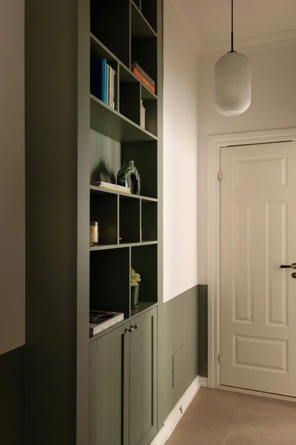 Two-Tone Walls Ideas: Create A Color Blocking Accent Wall 15 built-in-green-bookcase-half-painted-wall-nordroom