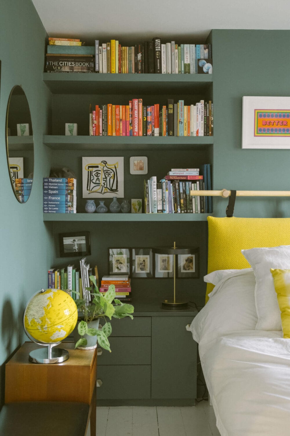 A Victorian House in London Decorated in Warm Color Tones 29 built-in-shelves-green-bedroom-yellow-cushions-nordroom