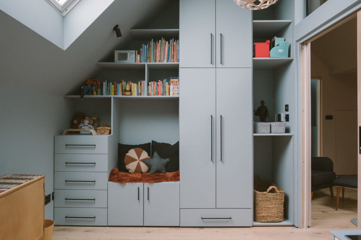 A Modern Split-Level Home with Colorful Rooms 19 built-in-wardrobes-shelves-seating-blue-kids-bedroom-nordroom