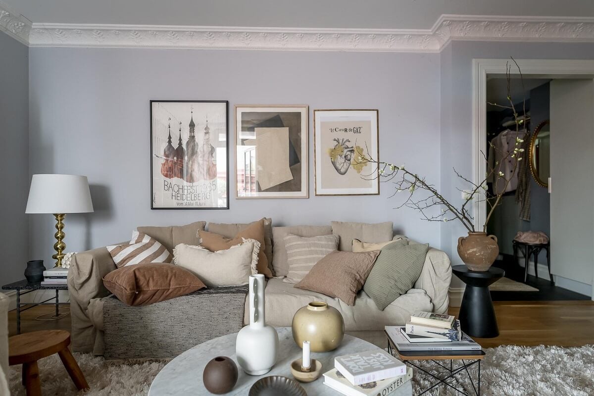 Layered Textiles and Dusty Colors in a Nordic Apartment 2 cozy-neutral-sitting-room-layered-textiles-light-blue-walls-nordroom