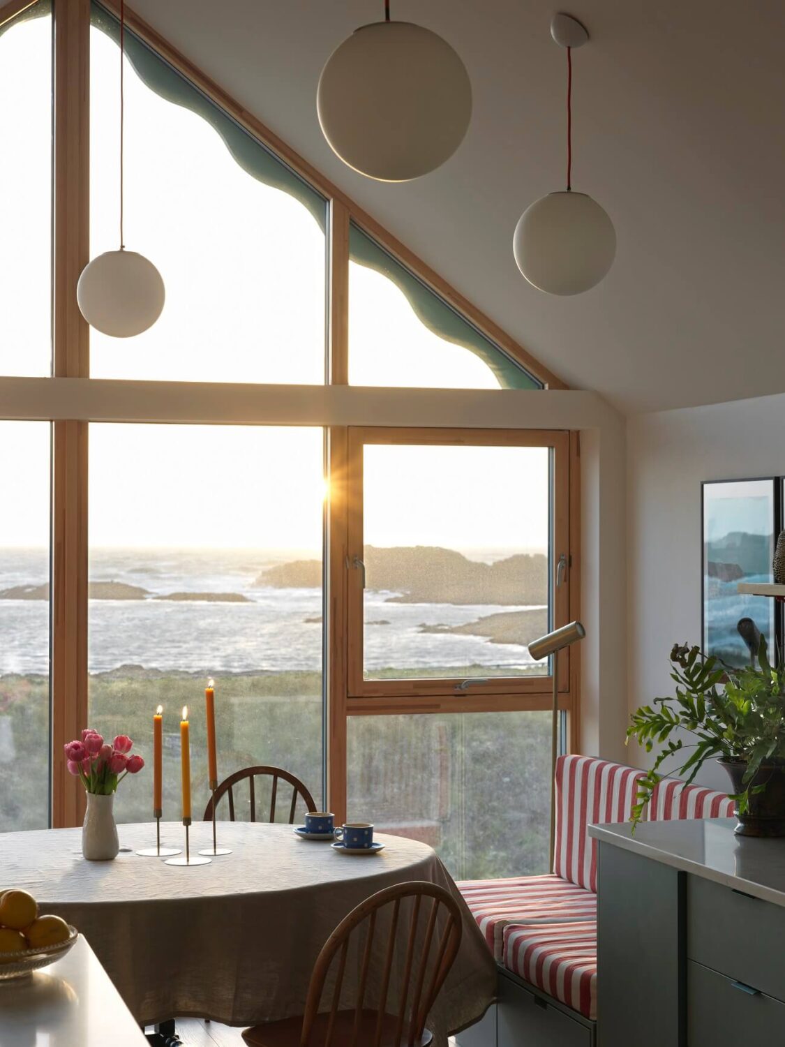A Colorful House By The Sea Designed by Space A 1 dining-space-bench-striped-textiles-high-pitched-ceiling-sea-view-nordrom