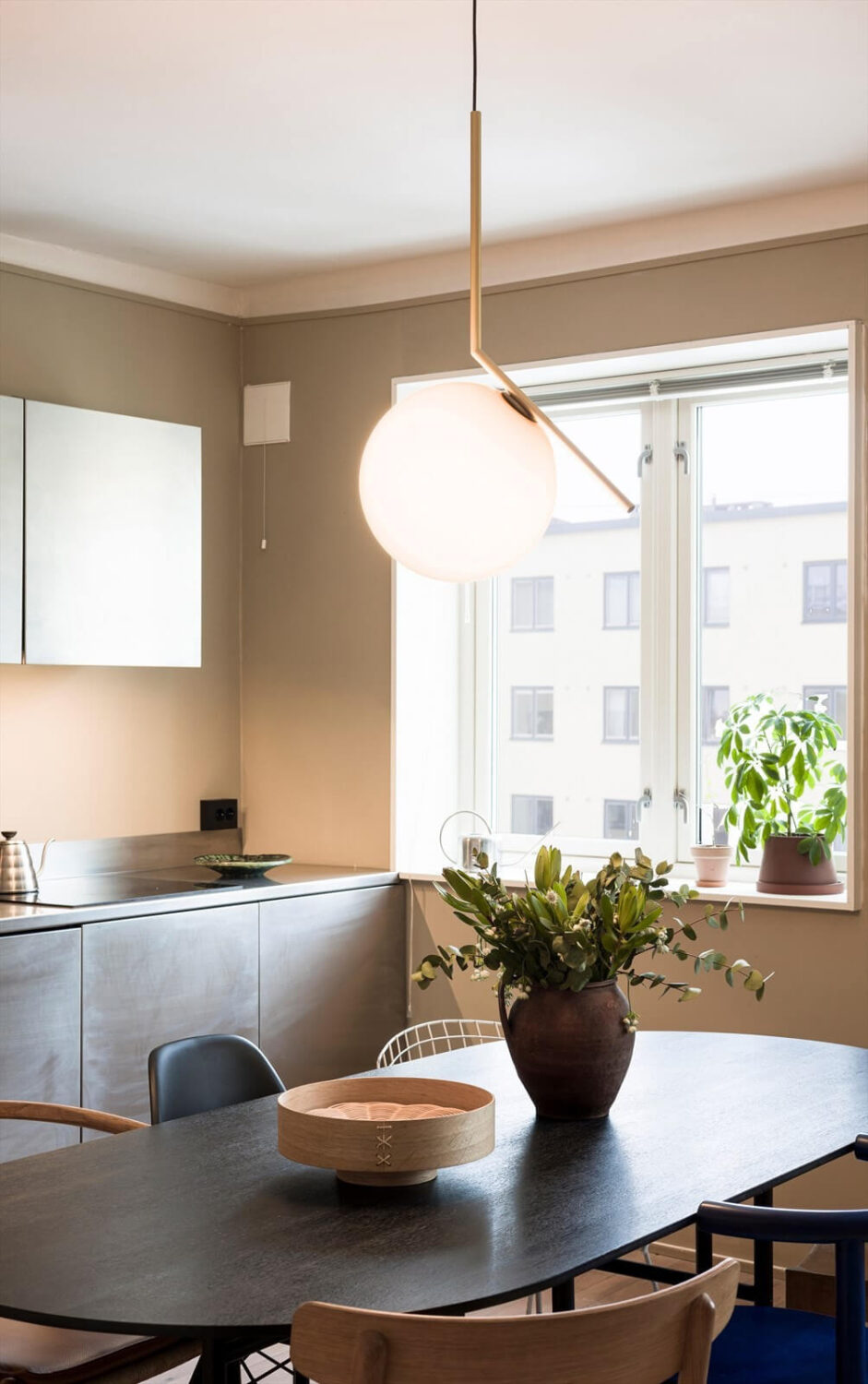 A Modern Oslo Apartment with Custom Furniture and Storage 7 dining-table-stainless-steel-kitchen-nordroom