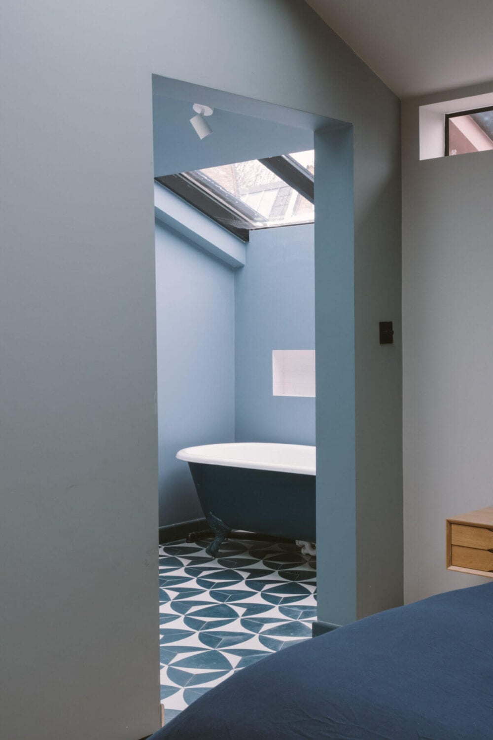 A Modern Split-Level Home with Colorful Rooms 23 en-suite-bathroom-blue-walls-tiles-freestanding-bath-nordroom