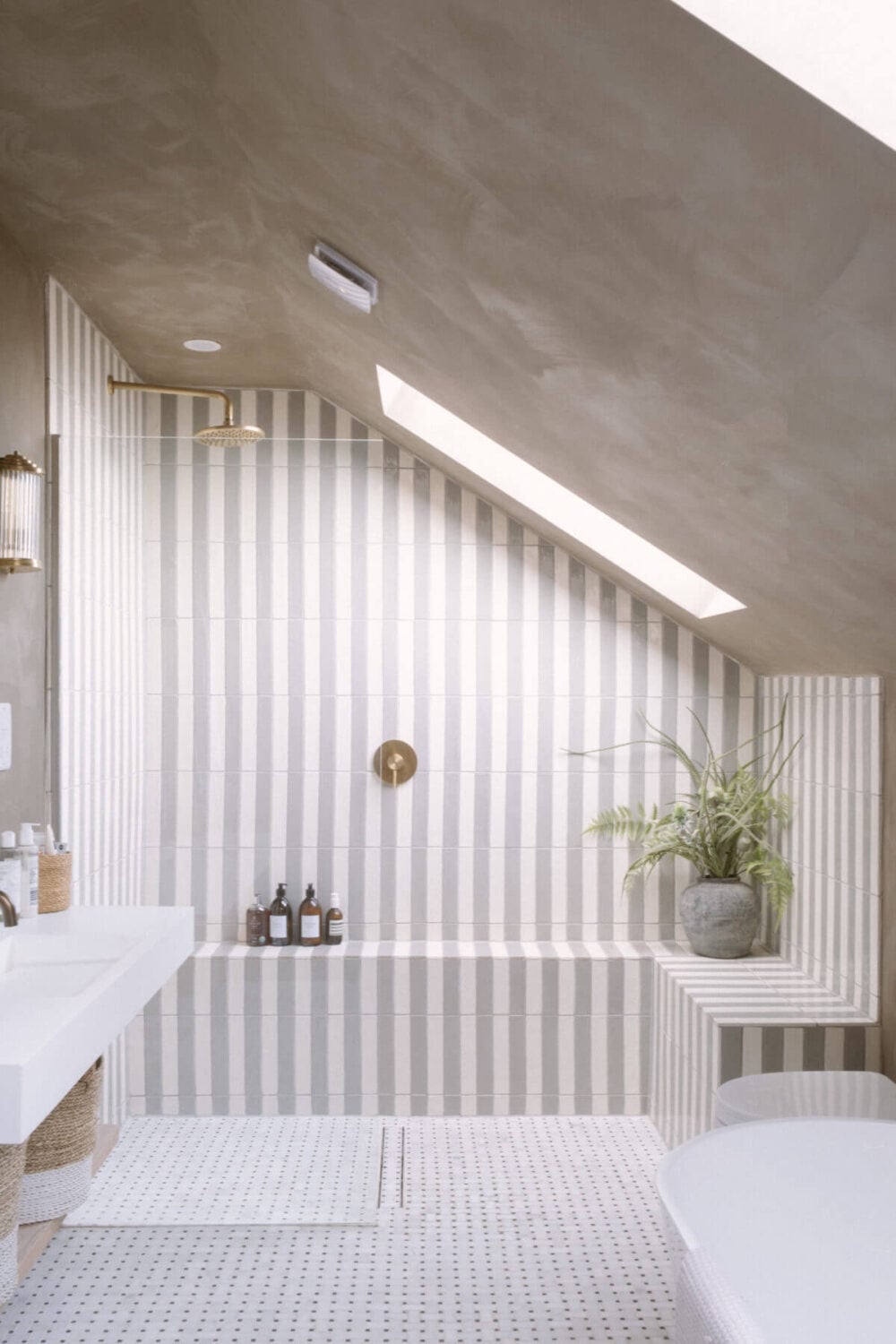 A Serene Renovated Victorian House in London 30 gray-white-bathroom-slanted-ceiling-striped-tilework-nordroom
