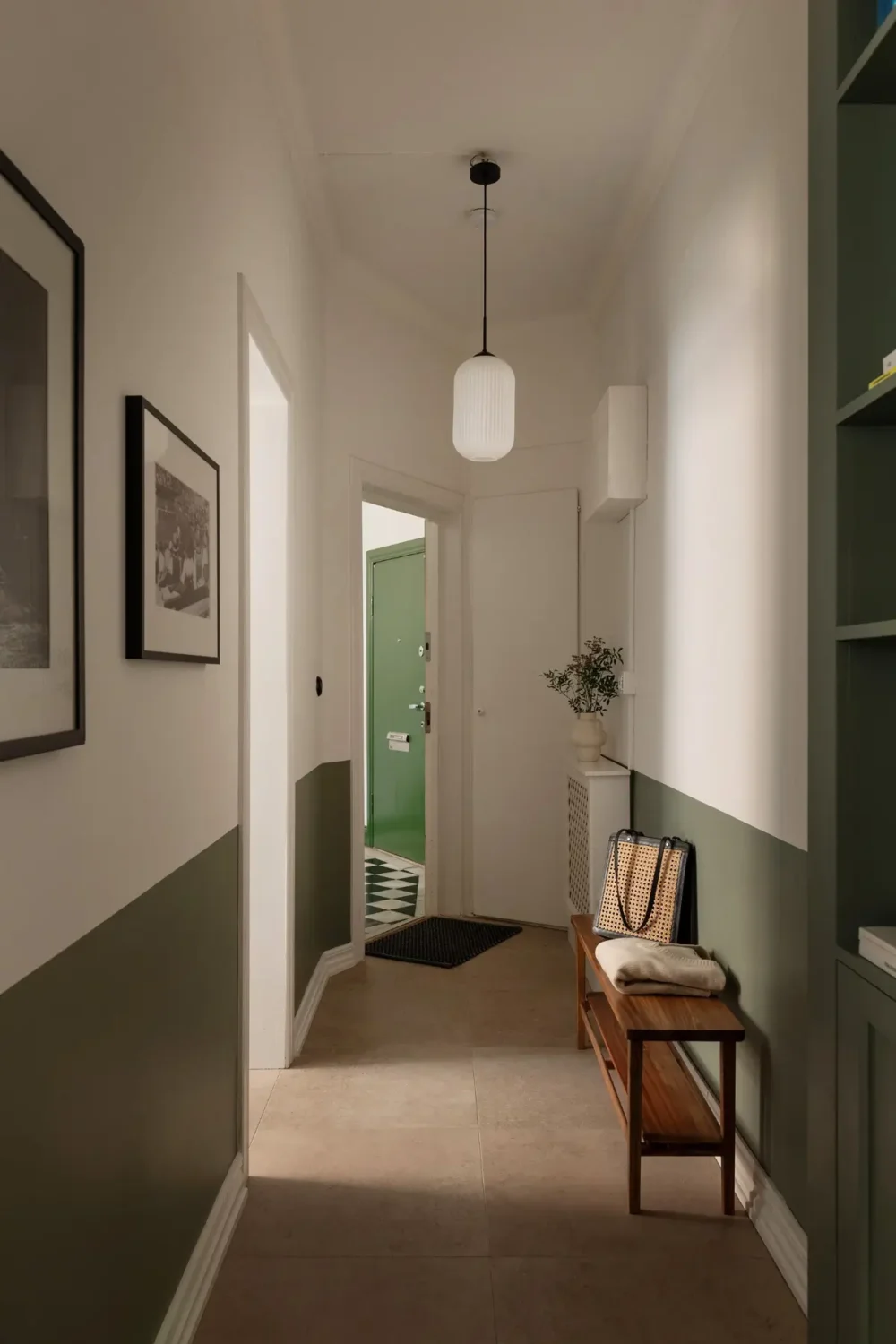 Two-Tone Walls Ideas: Create A Color Blocking Accent Wall 16 hall half painted green wall built in bookshelves nordroom Two-Tone Walls Ideas: Create A Color Blocking Accent Wall