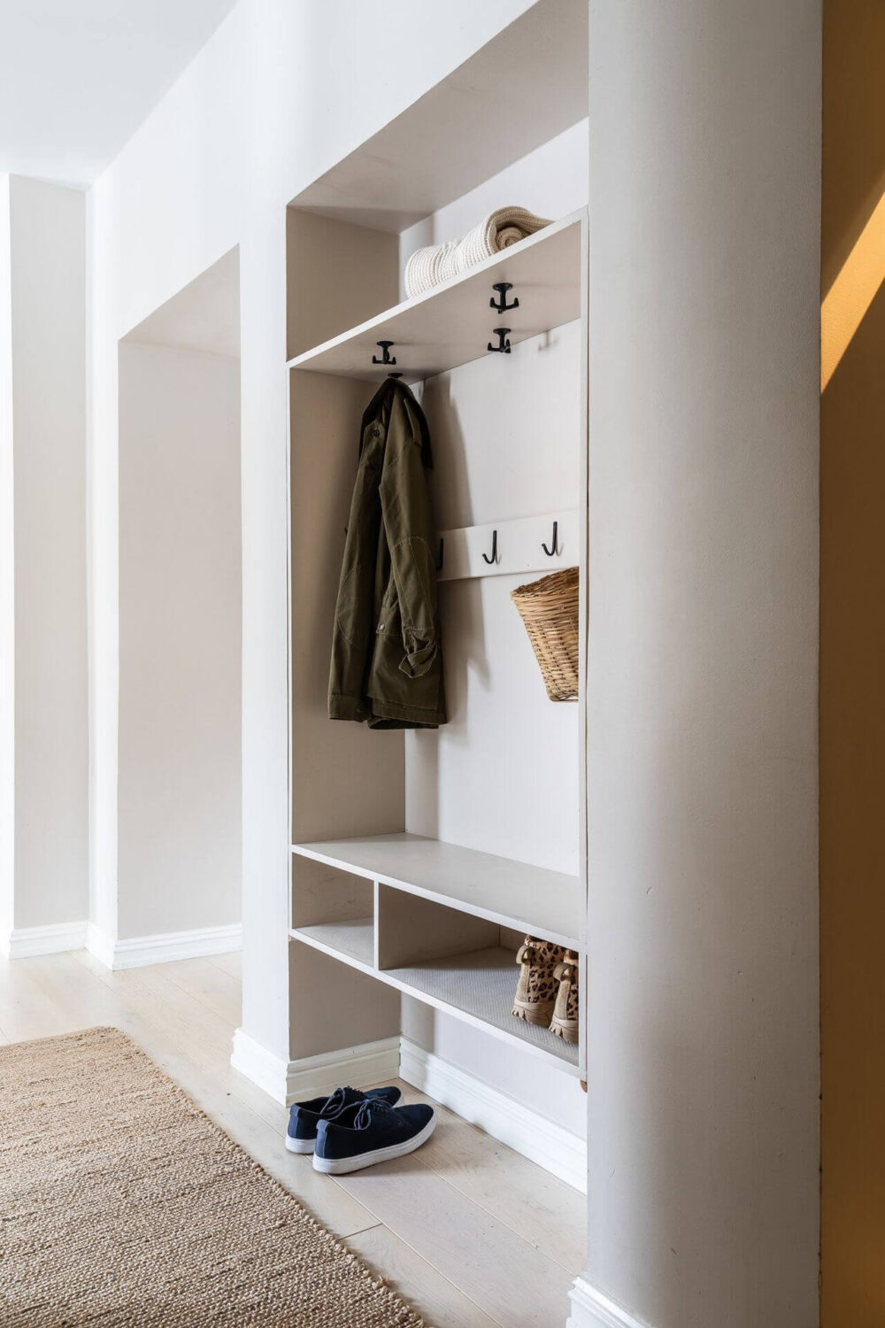 Soft Neutral Colors in a Norwegian Maisonette Home 17 hallway-built-in-closet-storage-space-nordroom