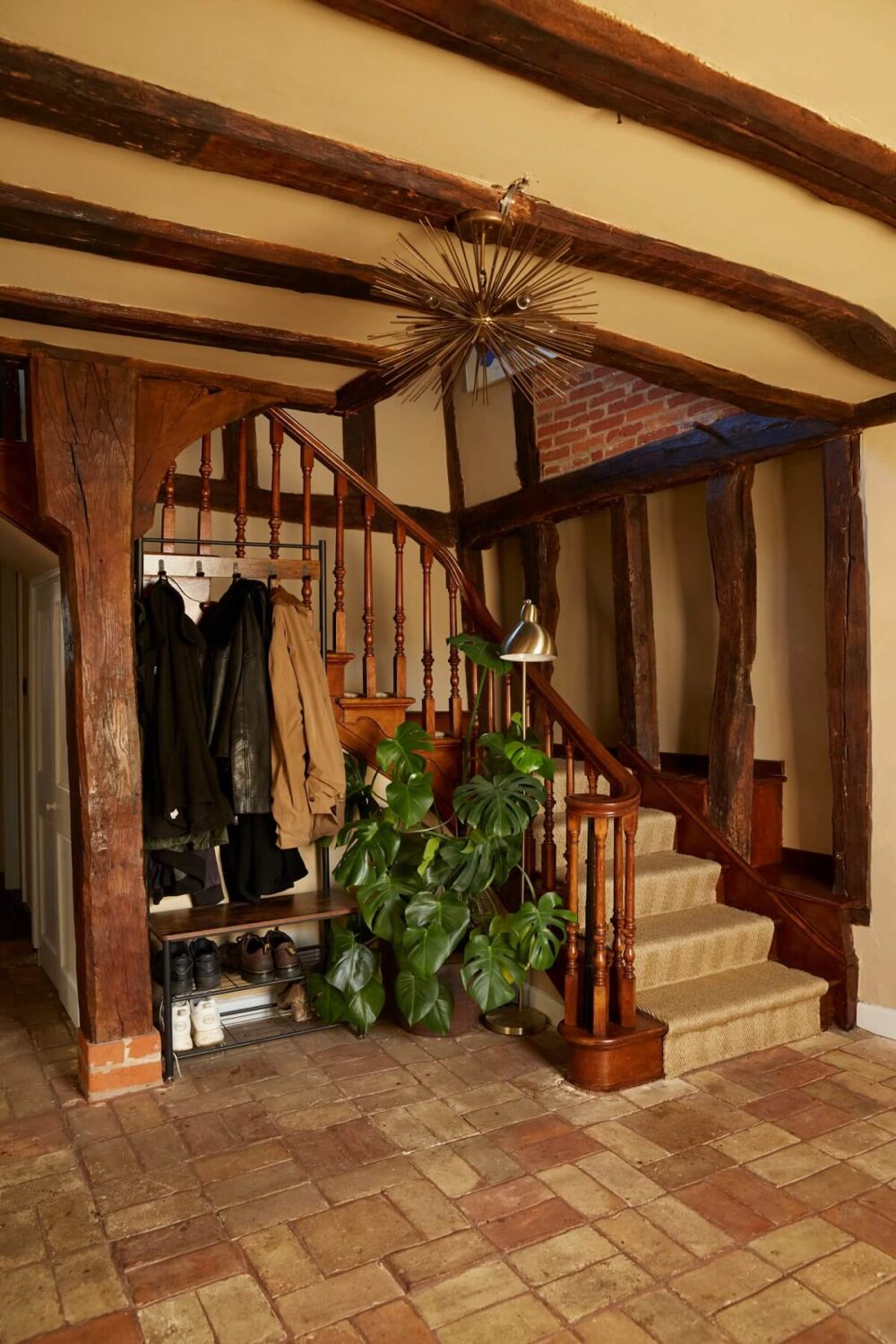A Pink English Home That's Brimming with History 16 hallway-staircase-wooden-ceiling-beams-stone-floor-nordroom