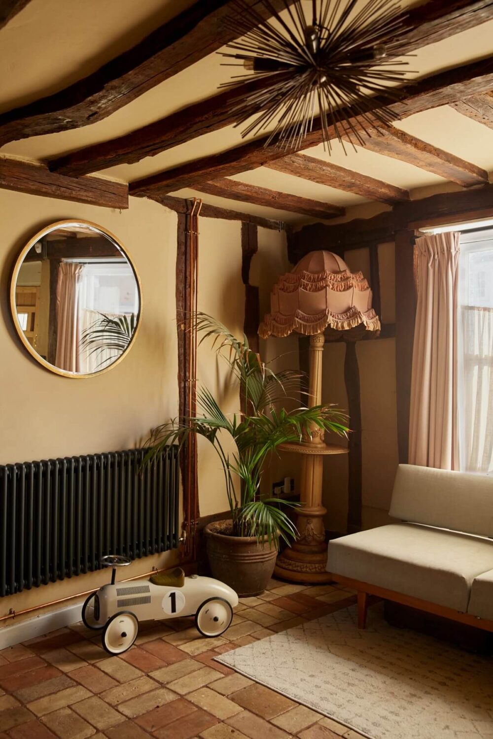 A Pink English Home That's Brimming with History 15 hallway-stone-floor-bench-exposed-beams-nordroom