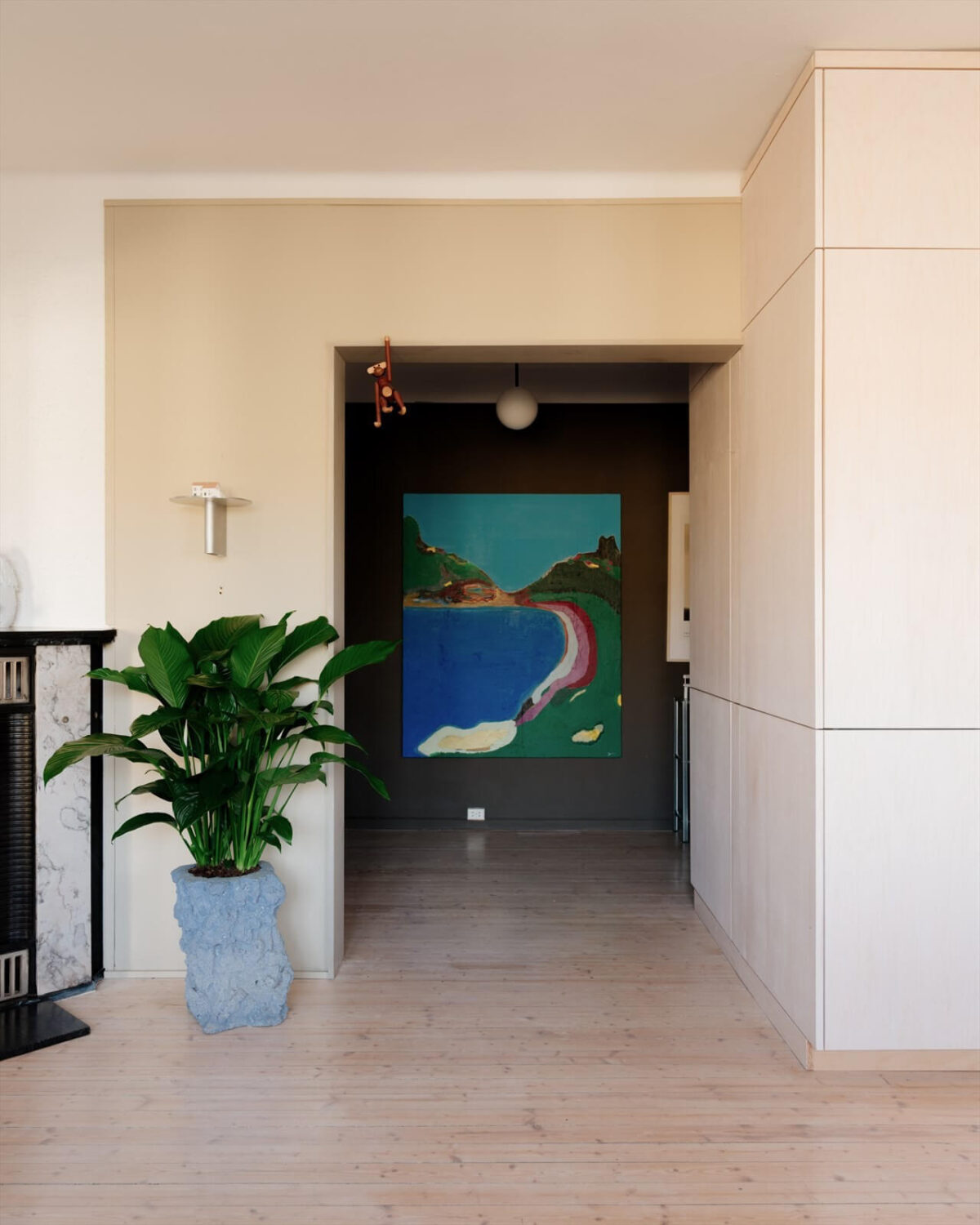 A Modern Oslo Apartment with Custom Furniture and Storage 16 hallway-view-dark-walls-large-art-nordroom
