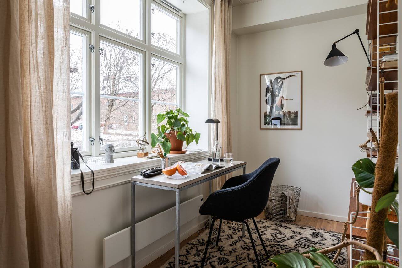 Soft Neutral Colors in a Norwegian Maisonette Home 11 home-office-rug-bookshelves-nordroom