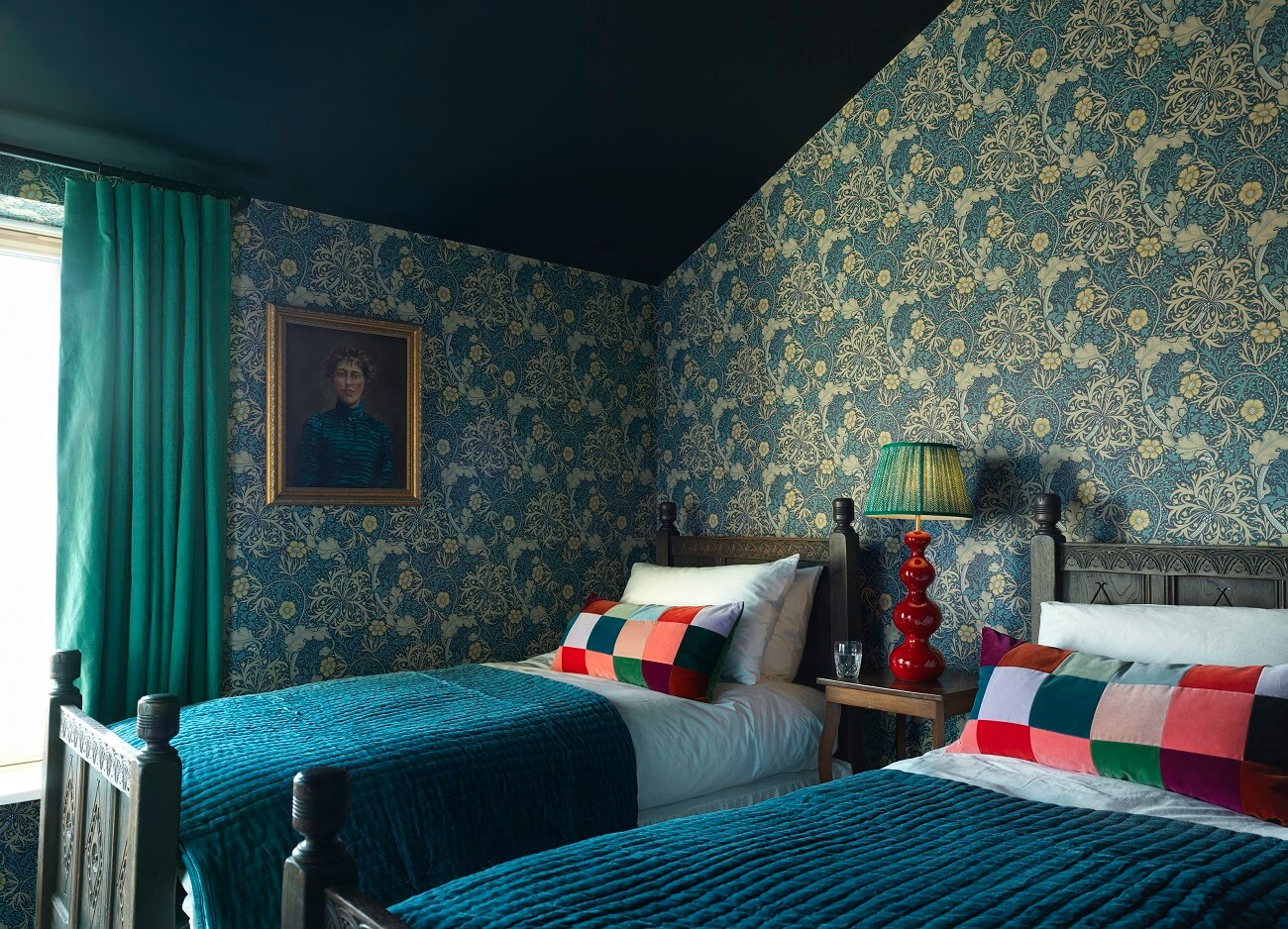 A Colorful House By The Sea Designed by Space A 13 kids-bedroom-double-twin-beds-wallpaper-dark-blue-slanted-ceiling-nordroom
