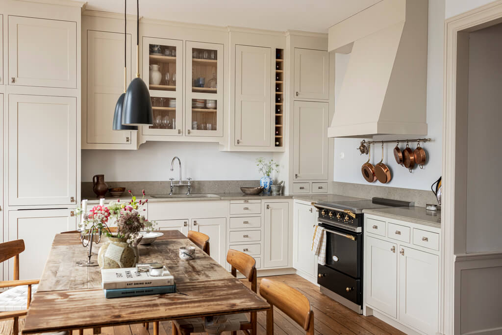 A Scandinavian Apartment with Antique Furniture 5 kitchen-beige-cabinets-wooden-dining-table-nordroom