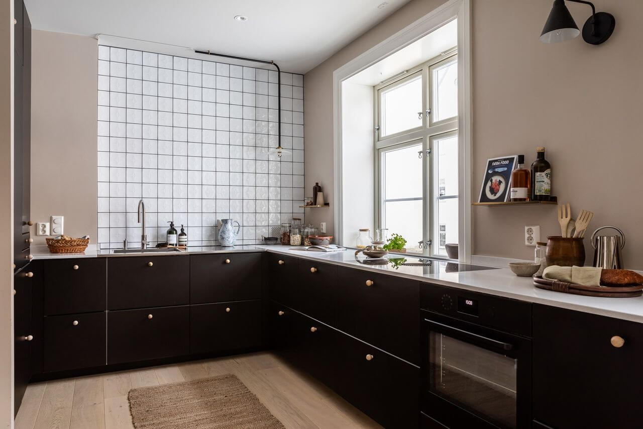 Soft Neutral Colors in a Norwegian Maisonette Home 7 kitchen-black-cabinets-square-white-tiles-nordroom