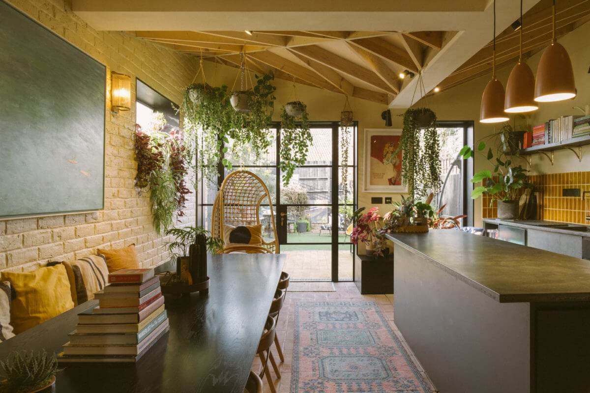 A Victorian House in London Decorated in Warm Color Tones 2 kitchen-dining-room-plants-wooden-beams-crittal-doors-nordroom