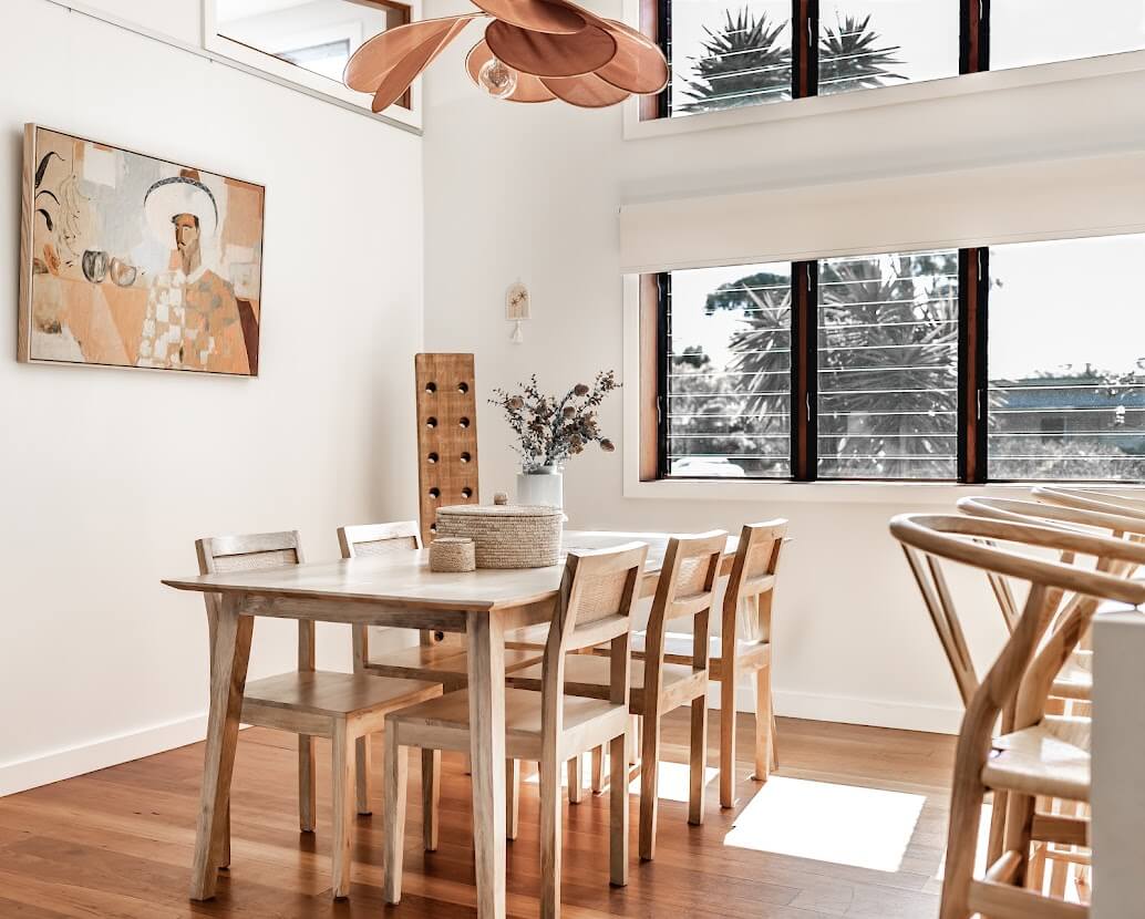 Oyster Catcher Huskisson: A Sustainable Beach House in Australia 5 kitchen-dining-table-high-windows-beach-house-nordroom