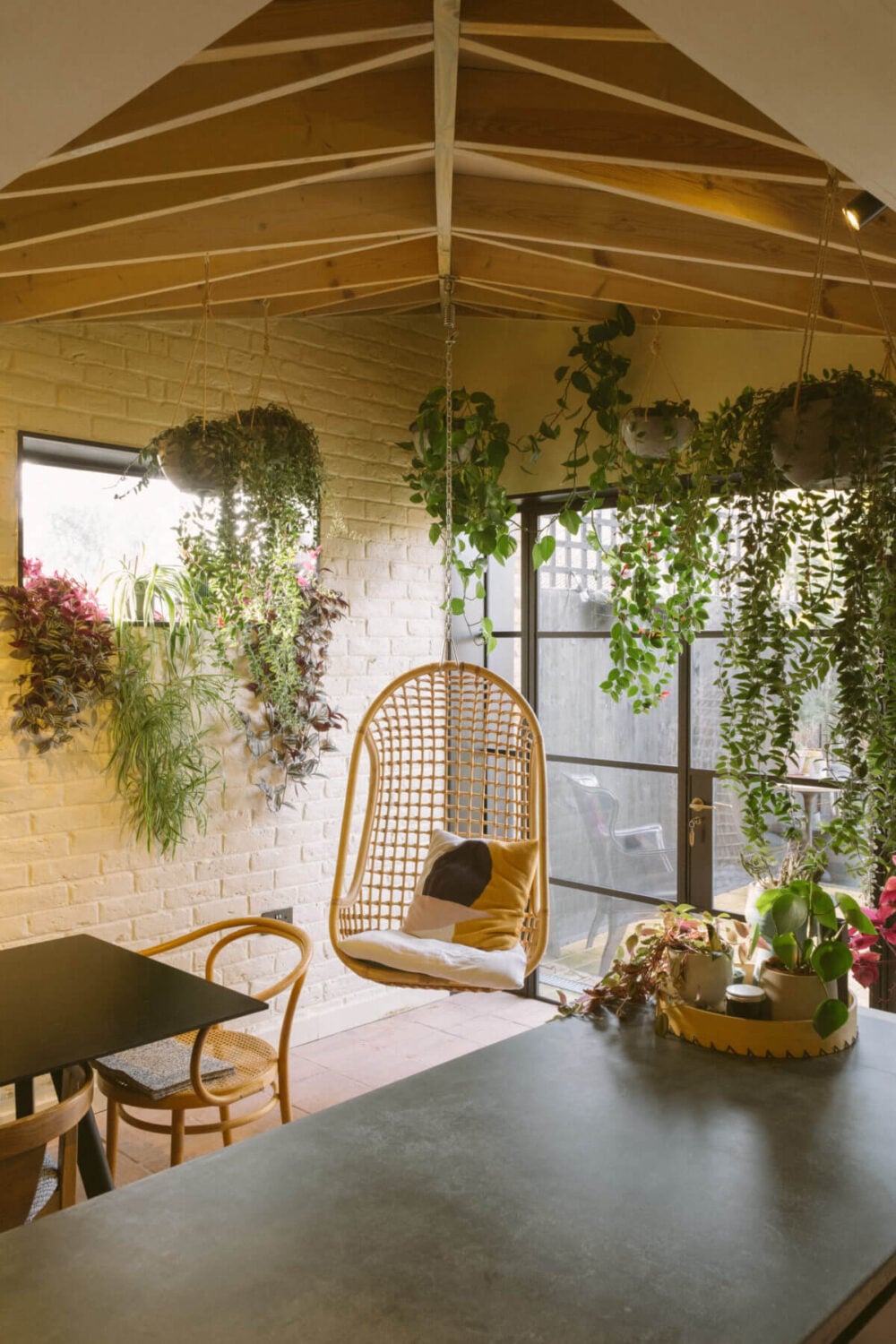A Victorian House in London Decorated in Warm Color Tones 4 kitchen-exposed-beam-ceiling-rattan-hanging-chair-plants-nordroom