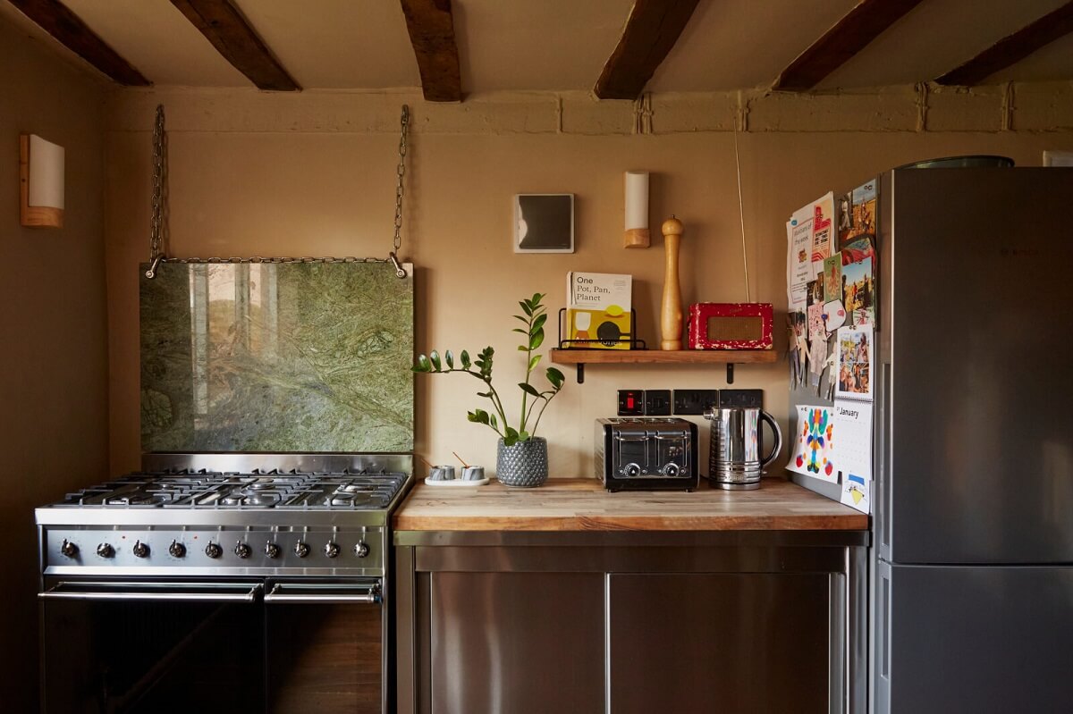 A Pink English Home That's Brimming with History 11 kitchen-exposed-wooden-beams-nordroom