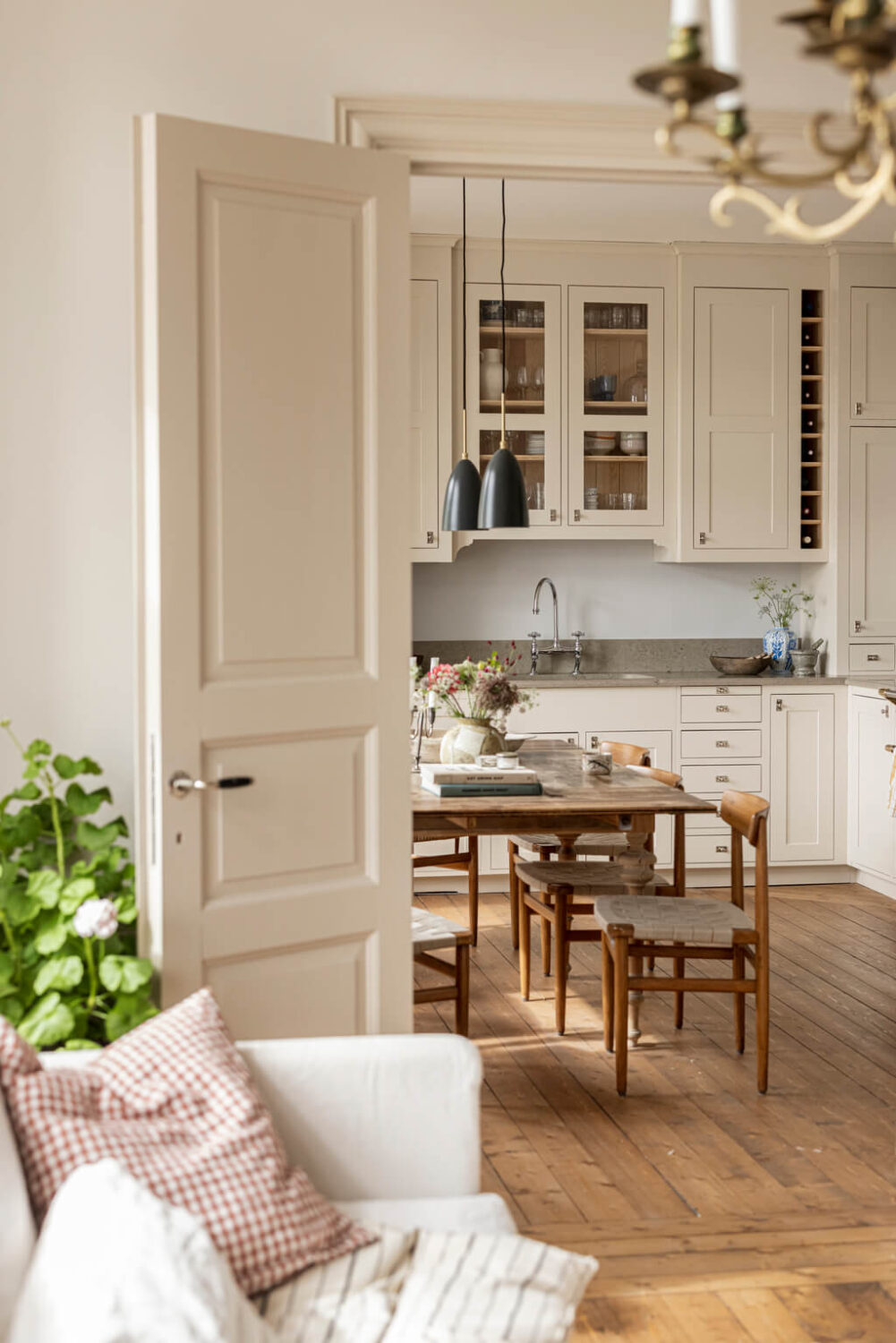 A Scandinavian Apartment with Antique Furniture 4 kitchen-living-room-double-doors-wooden-floor-nordroom