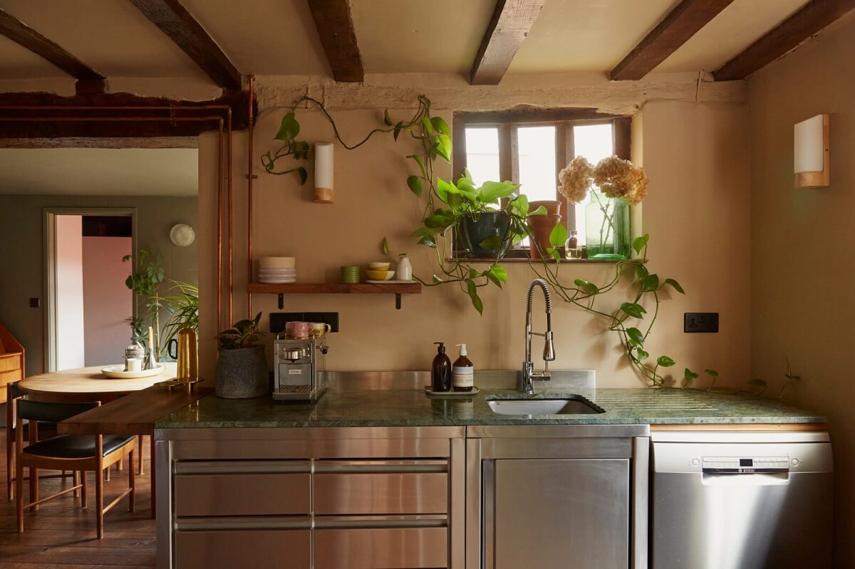 A Pink English Home That's Brimming with History 12 kitchen-small-window-plants-exposed-wooden-beams-nordroom