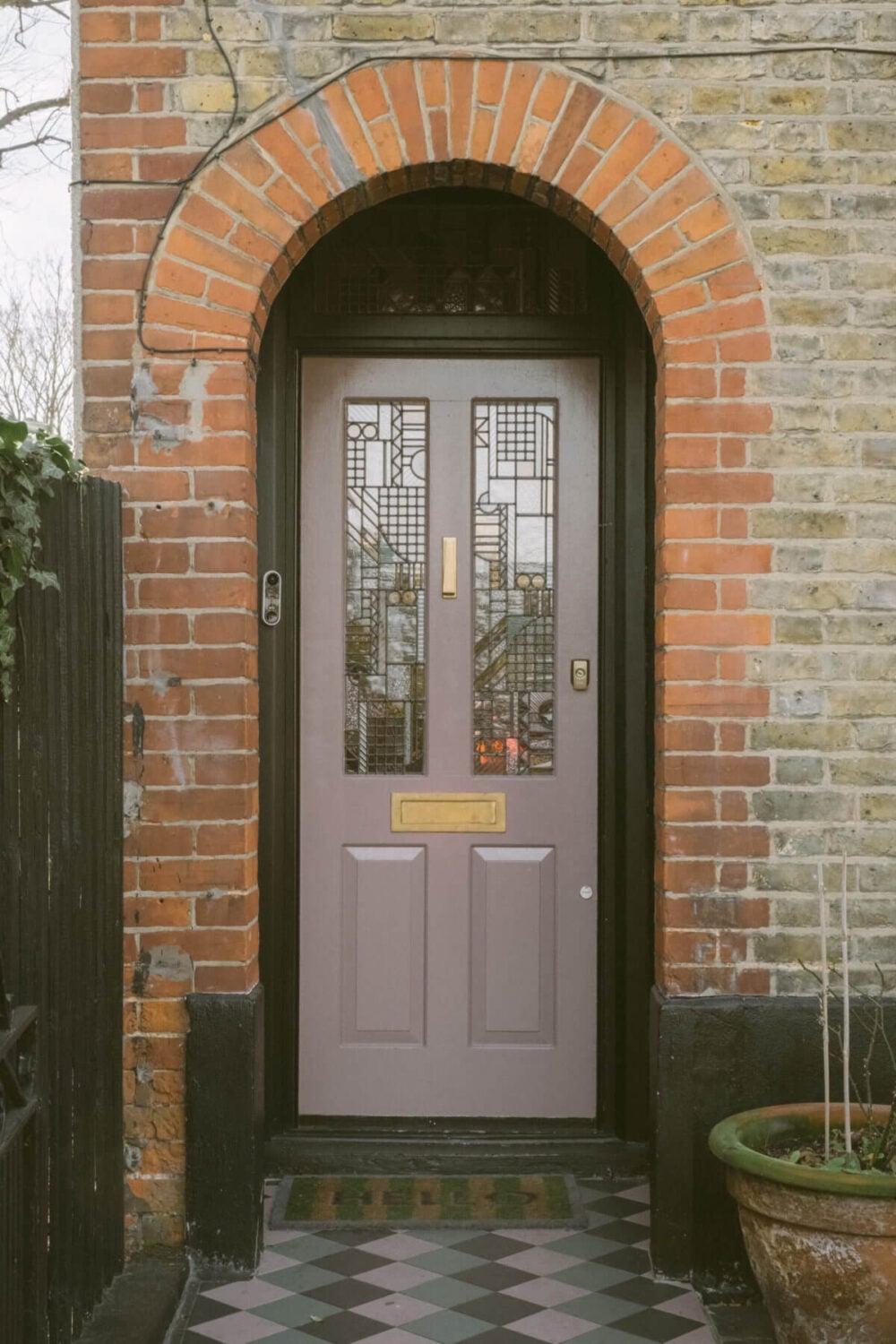 A Victorian House in London Decorated in Warm Color Tones 37 lavender-front-door-arched-doorway-exterior-victorian-house-london-nordroom