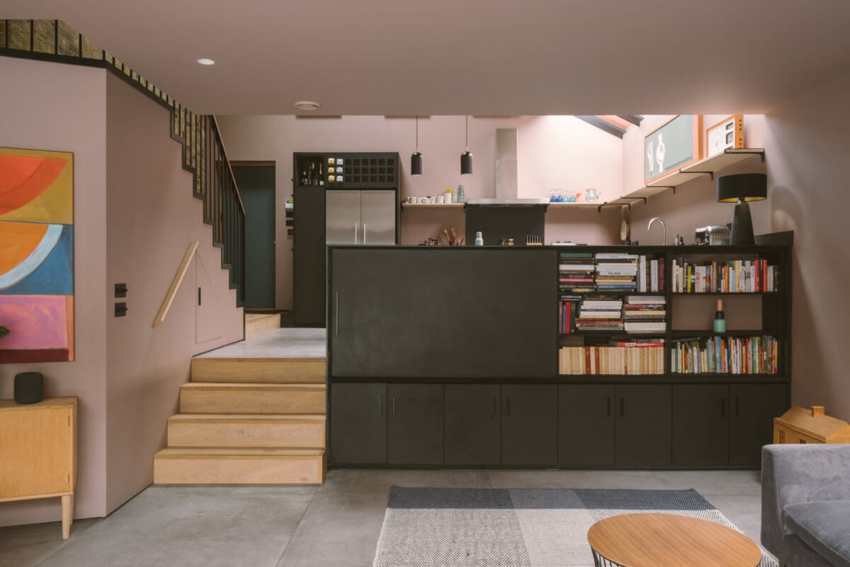 A Modern Split-Level Home with Colorful Rooms 6 living-room-built-in-bookcase-split-level-pink-walls-nordroom